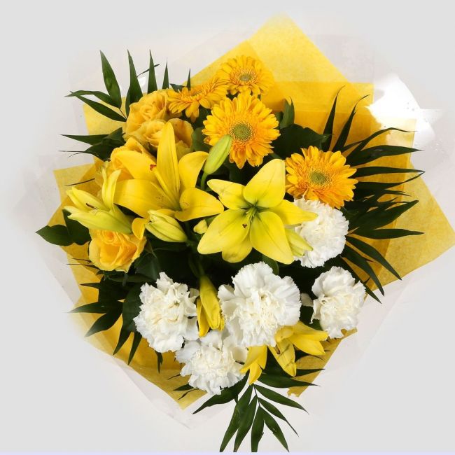 Golden Sunshine Flowers BouquetGolden Sunshine Bouquet, This lovely selection of flowers is the perfect gift for any occasion. White Dianthus, Yellow Roses & Yellow Lillies with assorted foliage are beautifully presented. Beautifully wrapped and tied with