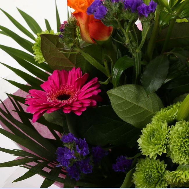 Melody Bright BouquetMelody Bright Bouquet, This bouquet of flowers is a sweet selection Cerise Germini, Oranage Roses, Yellow Lillies with Shamrock Chrysanthemums and Foliage.this bouquet is full of pretty shades . It's absolutely perfect. Beautifully wr