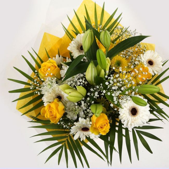 Lemon & White BouquetLemon & White Bouquet, We know how much you like this bouquet! lovely fresh Yellow Roses contrast against the white Gypsophila, with palm leaves, White Germini and Chrysanthemums, lovely bunch of flowers. Beautifully wrapped and tied