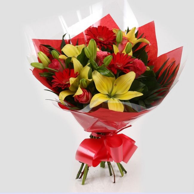 Emporium Flowers BouquetEmporium Bouquet Gerberas, Roses, Oriental Lilies and Palm foliage are expertly arranged to create this dramatic design. This stunning gift is the ultimate gift to create an impression. Beautifully wrapped and tied with ribbon befo