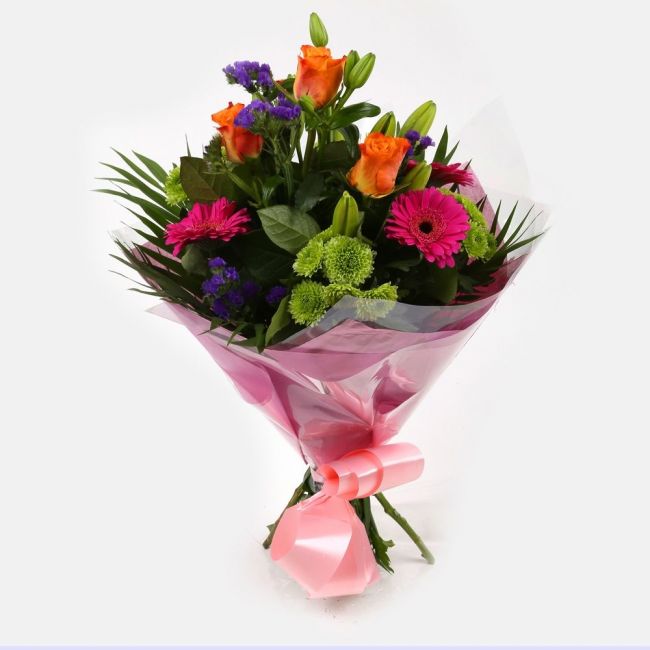Melody Bright BouquetMelody Bright Bouquet, This bouquet of flowers is a sweet selection Cerise Germini, Oranage Roses, Yellow Lillies with Shamrock Chrysanthemums and Foliage.this bouquet is full of pretty shades . It's absolutely perfect. Beautifully wr