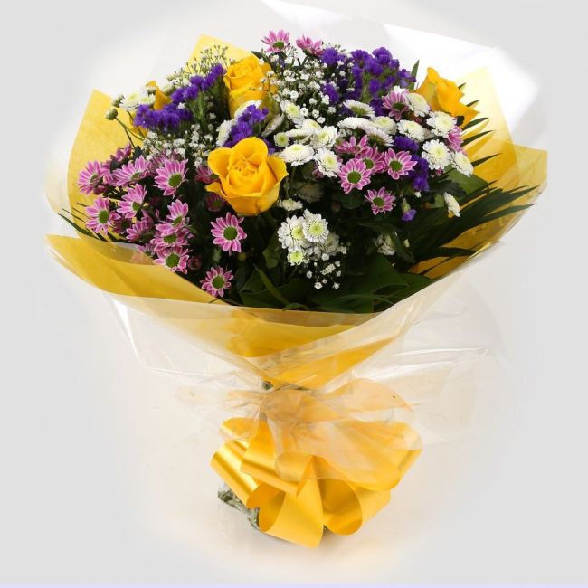 Charm Bouquet FlowersCharm Bouquet, This beautiful bouquet says everything. a beautiful gift,this bouquet is made up of Santini Chrsyanthemums, Yellow Roses, Statice with Foliage. Beautifully wrapped and tied with ribbon before being delivered.£14.99