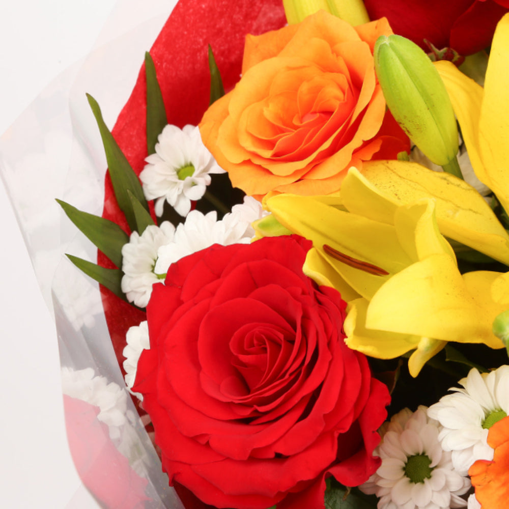 Floral Embrace Flowers BouquetThis Beautiful Bouquet, carefully selected flowers with foliage are expertly arranged to create this dramatic design. This stunning gift is the ultimate gift to create an impression. Beautifully wrapped and tied with ribbon b