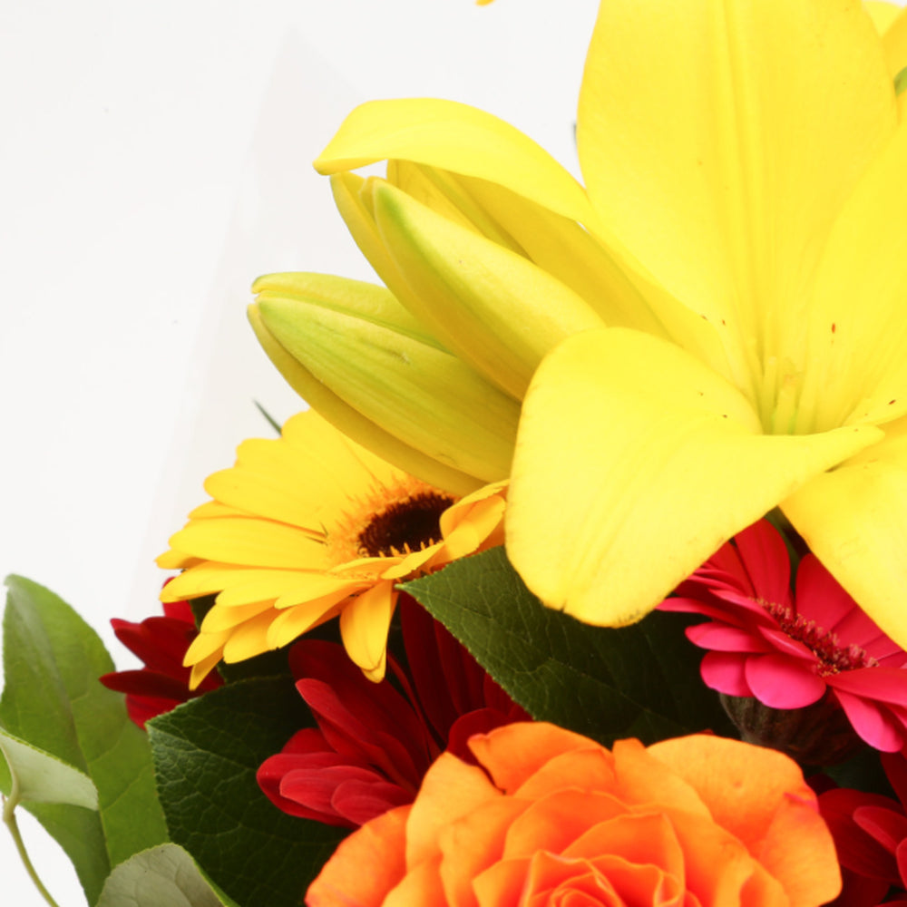 Congratulations Balloon & Warm Sunset FlowersThis Beautiful Bouquet, carefully selected flowers with foliage are expertly arranged to create this dramatic design. This stunning gift is the ultimate gift to create an impression. Beautifully wrapped and tie