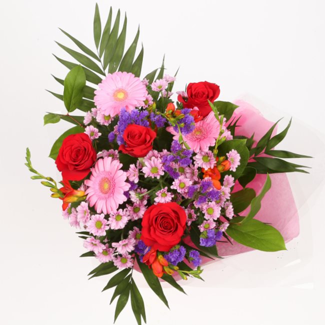 Birthday Balloon & Red Blush FlowersThis Beautiful Bouquet with Balloon, carefully selected flowers with foliage are expertly arranged to create this dramatic design. This stunning gift is the ultimate gift to create an impression. Beautifully wrapped and