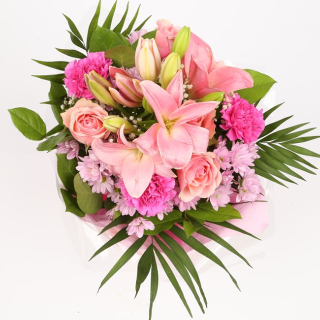 Pink Candy BouquetThis Beautiful Bouquet, carefully selected flowers with foliage are expertly arranged to create this dramatic design. This stunning gift is the ultimate gift to create an impression. Beautifully wrapped and tied with ribbon before being
