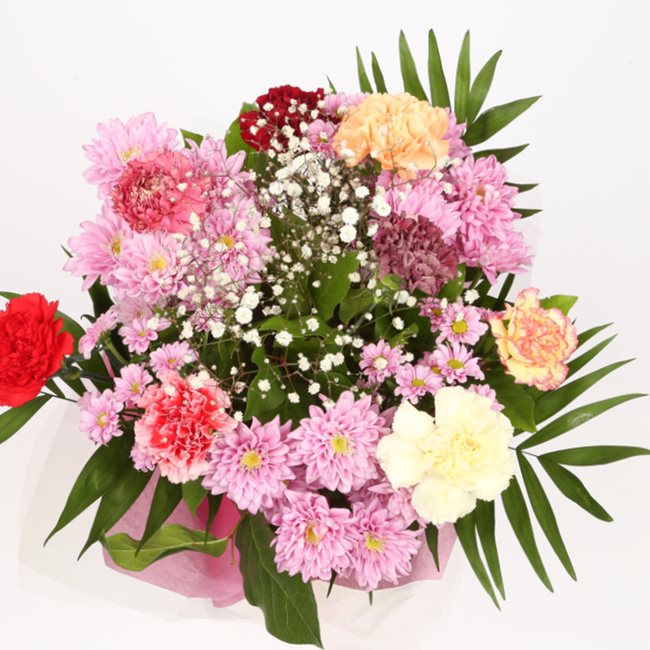 Confetti Flowers BouquetThis Beautiful Bouquet, carefully selected flowers with foliage are expertly arranged to create this dramatic design. This stunning gift is the ultimate gift to create an impression. Beautifully wrapped and tied with ribbon before