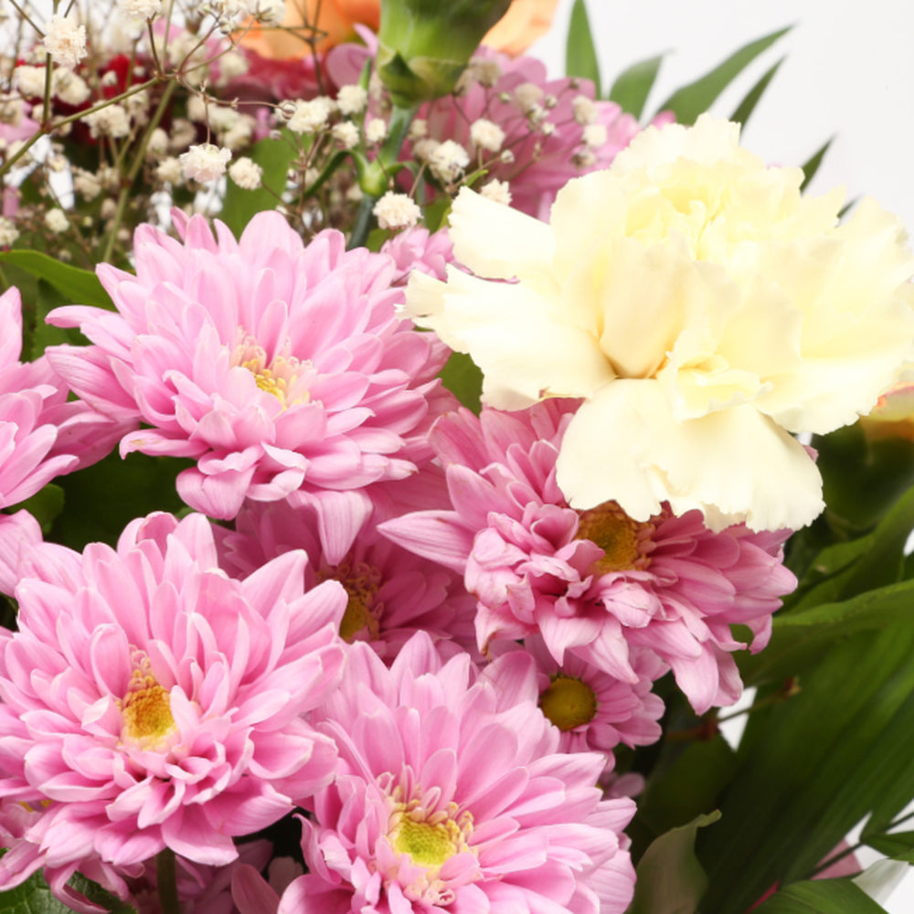 Confetti Flowers BouquetThis Beautiful Bouquet, carefully selected flowers with foliage are expertly arranged to create this dramatic design. This stunning gift is the ultimate gift to create an impression. Beautifully wrapped and tied with ribbon before