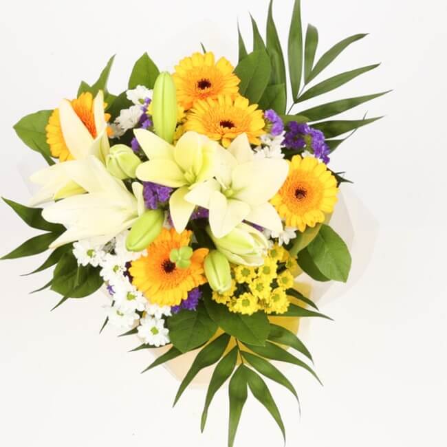 Sunshine Gold BouquetThis Beautiful Bouquet, carefully selected flowers with foliage are expertly arranged to create this dramatic design. This stunning gift is the ultimate gift to create an impression. Beautifully wrapped and tied with ribbon before bei