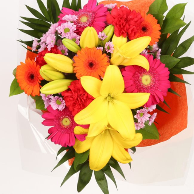 Summer Sun BouquetThis Beautiful Bouquet, carefully selected flowers with foliage are expertly arranged to create this dramatic design. This stunning gift is the ultimate gift to create an impression. Beautifully wrapped and tied with ribbon before being