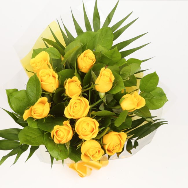 Birthday Balloon & 12 Yellow Roses FlowersThis Beautiful Bouquet, carefully selected flowers with foliage are expertly arranged to create this dramatic design. This stunning gift is the ultimate gift to create an impression. Beautifully wrapped and tied w