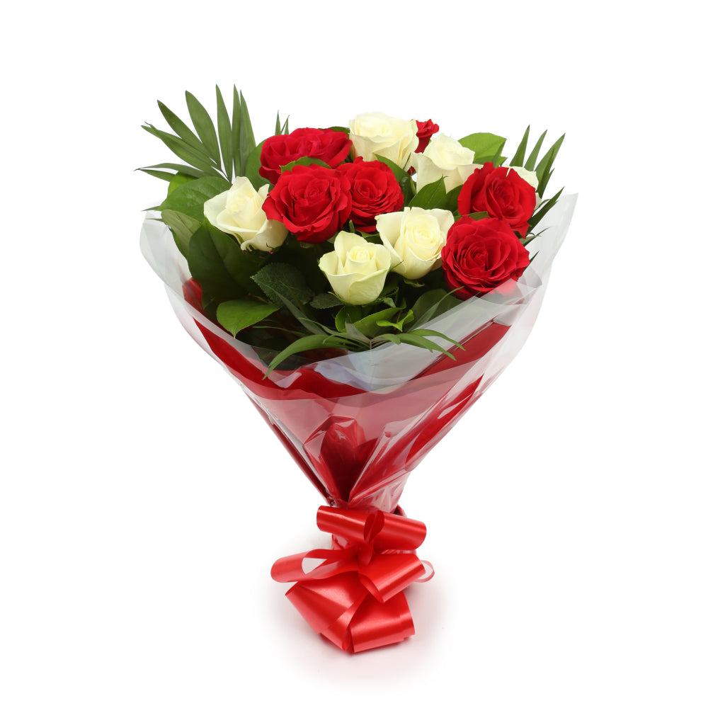 Red & White Roses BouquetThis Beautiful Bouquet, carefully selected flowers with foliage are expertly arranged to create this dramatic design. This stunning gift is the ultimate gift to create an impression. Beautifully wrapped and tied with ribbon before