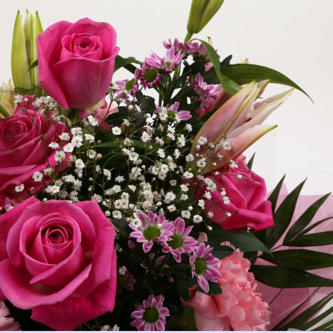 Birthday Balloon & Pink Crystal FlowersHappy Birthday Balloon & Beautiful Pink Crystal Bouquet, Pink Roses and Lillies with Gypsophila, Pink Dianthus, Pink Santini flowers and foliage, wrapped with matching ribbon. Beautifully wrapped and tied with ribbon