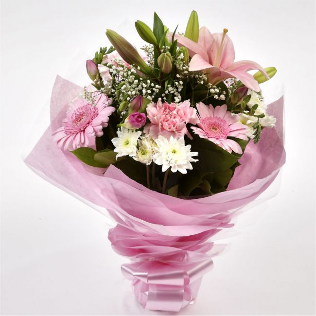 Pink Princess BouquetAn alluring hand-tied bouquet featuring Oriental Lilies, Gerberas, Anastasias, Gypsophila, in an array of pinks with striking Fressias & Chrysanthemums as highlights. A truly glamorous gift for any special occasion. Beautifully wrappe