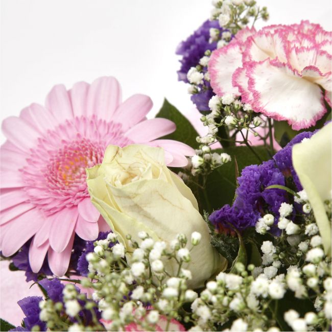 Pink Summer ChickThis Sweet Pink bouquet features matching pink Gerberas, Pink White Carnations, purple Statice and Pink Gypsophila, punctuated with White Roses. Expertly created by our florists Beautifully wrapped and tied with ribbon before being delive