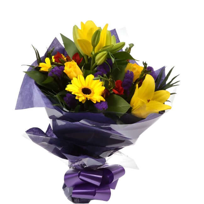 Yellow Blush BouquetAn alluring hand-tied bouquet featuring Oriental Lilies, Gerberas, , White Roses, Anastasia in an array of pinks with striking Bloom Chrysanthemums and Pink Gypsophila. A truly glamorous gift for any special occasion. Expertly created