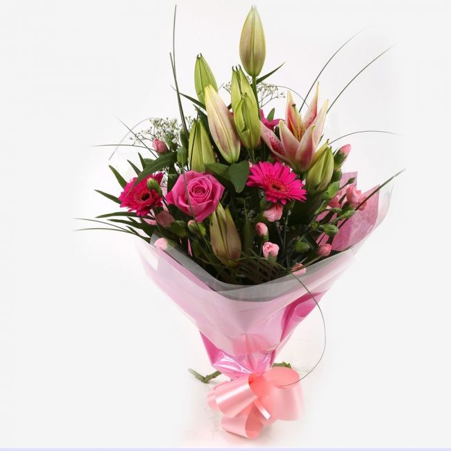 Pink Florence BouquetPink Florence Bouquet, This Lovely Pink Bouquet features matching Pink Roses, Gerberas, Pink Spray Carnations and Pink lillies, Gypsophila, punctuated with palm leaves, expertly created by our florists.£14.99