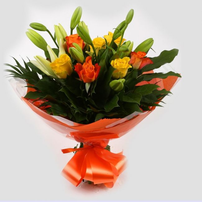 Aztec Yellow Bouquet FlowersA beautiful mix of Roses & Lillies flowers in soft shades of yellow & orange, along with palm leaves . Beautifully wrapped and tied with ribbon before being delivered.£14.99