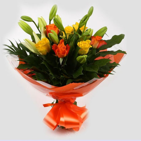 Aztec Yellow Bouquet FlowersA beautiful mix of Roses & Lillies flowers in soft shades of yellow & orange, along with palm leaves . Beautifully wrapped and tied with ribbon before being delivered.£14.99