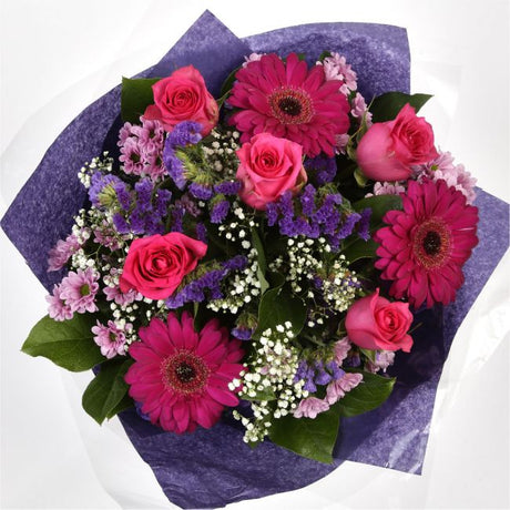 Beautiful Cerise Bouquet FlowersLarge-headed Roses combined with pretty Gerberas, Statice, Pink Gypsophila and foliage to create this beautifully scented bouquet. Each stem is expertly positioned by hand, hand crafted by one of our expert florists using t