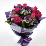 Beautiful Cerise Bouquet FlowersLarge-headed Roses combined with pretty Gerberas, Statice, Pink Gypsophila and foliage to create this beautifully scented bouquet. Each stem is expertly positioned by hand, hand crafted by one of our expert florists using t