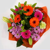 Colour Burst Flowers BouquetColour Burst Bouquet, Surprise a loved one with this gorgeous display of vibrant flowers, eye catching daisies, Yellow Lillies & Chrysanthemums, and Mint green Carnations.£14.99