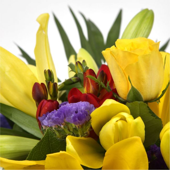 Delightful Flowers BouquetA Delightful Bouquet filled with flowers in Yellow and Purple shades. Including large-headed Roses, Lilies, Carnations, Freesias, a modern yet truly enchanting gift. Beautifully wrapped and tied with ribbon before being delivered