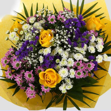 Charm Bouquet FlowersCharm Bouquet, This beautiful bouquet says everything. a beautiful gift,this bouquet is made up of Santini Chrsyanthemums, Yellow Roses, Statice with Foliage. Beautifully wrapped and tied with ribbon before being delivered.£14.99