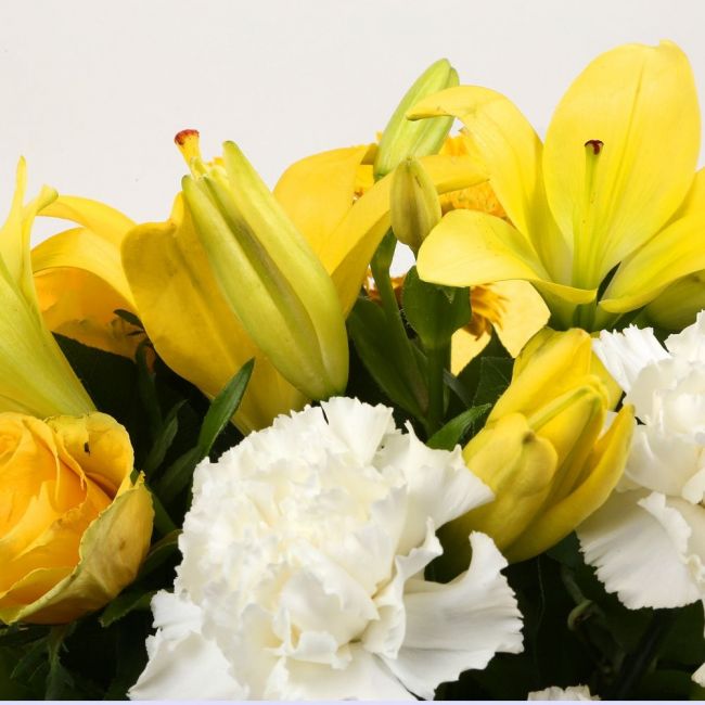 Golden Sunshine Flowers BouquetGolden Sunshine Bouquet, This lovely selection of flowers is the perfect gift for any occasion. White Dianthus, Yellow Roses & Yellow Lillies with assorted foliage are beautifully presented. Beautifully wrapped and tied with