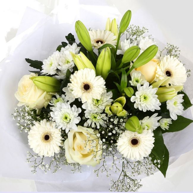 White Petite BouquetThis beautiful White bouquet says everything. a beautiful gift,this bouquet is made up of Roses,Chrsyanthemums, cream Germini, boom Chrysanthemums & Gypsophila. Beautifully wrapped and tied with ribbon before being delivered.£14.99