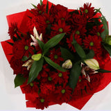 Red Rapture BouquetRed Rapture Bouquet Red Roses, Oriental Pink Lilies, Red Boom Carnations and Chrysanthemums with foliage are expertly arranged to create this dramatic design. This stunning gift is the ultimate gift to create an impression. Beautifully