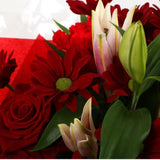 Red Rapture BouquetRed Rapture Bouquet Red Roses, Oriental Pink Lilies, Red Boom Carnations and Chrysanthemums with foliage are expertly arranged to create this dramatic design. This stunning gift is the ultimate gift to create an impression. Beautifully