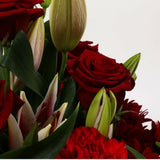 Red Roses & Lilly BouquetRed Roses & Lilly Bouquet, A beautiful Elegant bouquet featuring Red Roses, Pink Lillies, Red Chrysanthemums, Red Dianthus and Stylish Palm leaves with Foliage, perfect. Expertly created by our florists Beautifully wrapped and tie