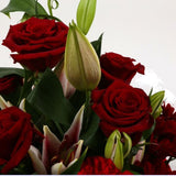 Red Roses & Lilly BouquetRed Roses & Lilly Bouquet, A beautiful Elegant bouquet featuring Red Roses, Pink Lillies, Red Chrysanthemums, Red Dianthus and Stylish Palm leaves with Foliage, perfect. Expertly created by our florists Beautifully wrapped and tie