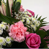 Strawberry Sundae BouquetStrawberry Sundae Bouquet, An endearing classic Bouquet, Lilies in soft pinks, White Santini, with Pink Roses, large exquisite headed Dianthus, Pink Roses are complemented by delicate Gypsophila, luxurious sophisticated hand-tied