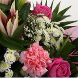 Strawberry Sundae BouquetStrawberry Sundae Bouquet, An endearing classic Bouquet, Lilies in soft pinks, White Santini, with Pink Roses, large exquisite headed Dianthus, Pink Roses are complemented by delicate Gypsophila, luxurious sophisticated hand-tied