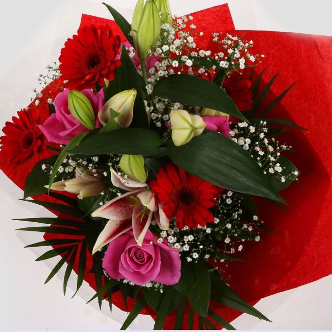 Pink Oriental BouquetPink Oriental Bouquet, Pink Roses, Oriental Lilies, Gypsophila with Red Germini and Palm foliage are expertly arranged to create this dramatic design. This stunning gift is the ultimate gift to create an impression.£14.99