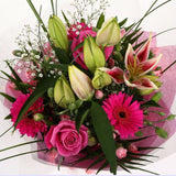 Pink Florence BouquetPink Florence Bouquet, This Lovely Pink Bouquet features matching Pink Roses, Gerberas, Pink Spray Carnations and Pink lillies, Gypsophila, punctuated with palm leaves, expertly created by our florists.£14.99