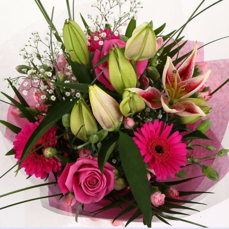 Pink Florence BouquetPink Florence Bouquet, This Lovely Pink Bouquet features matching Pink Roses, Gerberas, Pink Spray Carnations and Pink lillies, Gypsophila, punctuated with palm leaves, expertly created by our florists.£14.99
