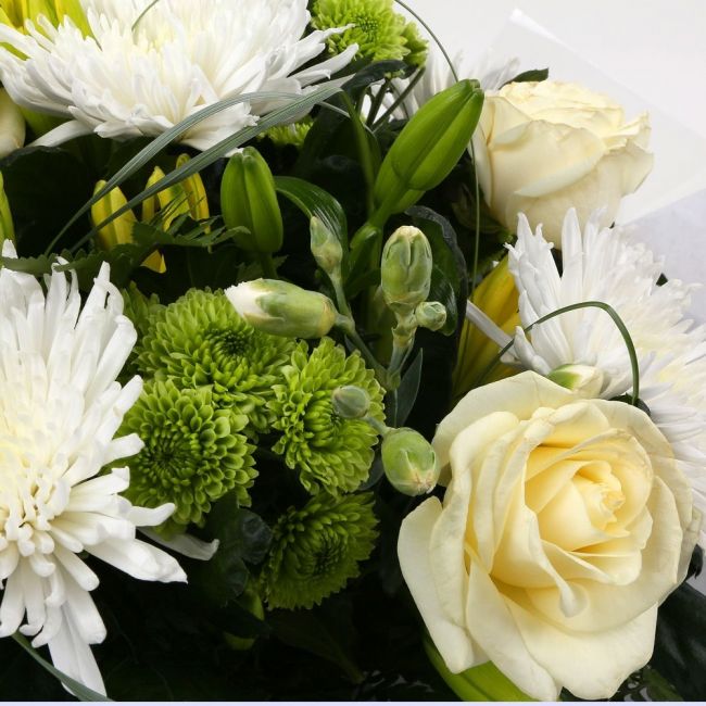 Golden Cream Flowers BouquetGolden Cream Bouquet, This lovely selection of flowers is the perfect gift for any occasion. White Boom chrysanthemums, White Cream Roses & Yellow Lillies with Shamrock flowers and assorted foliage are beautifully presented. Be