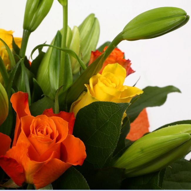 Aztec Yellow Bouquet FlowersA beautiful mix of Roses & Lillies flowers in soft shades of yellow & orange, along with palm leaves . Beautifully wrapped and tied with ribbon before being delivered.£14.99