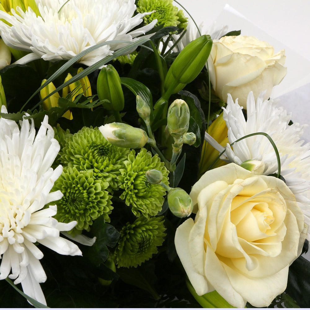 Golden Cream Flowers BouquetGolden Cream Bouquet, This lovely selection of flowers is the perfect gift for any occasion. White Boom chrysanthemums, White Cream Roses & Yellow Lillies with Shamrock flowers and assorted foliage are beautifully presented. Be