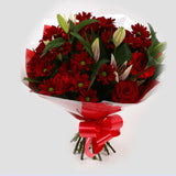 Red Rapture BouquetRed Rapture Bouquet Red Roses, Oriental Pink Lilies, Red Boom Carnations and Chrysanthemums with foliage are expertly arranged to create this dramatic design. This stunning gift is the ultimate gift to create an impression. Beautifully