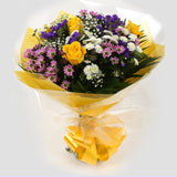 Charm Bouquet FlowersCharm Bouquet, This beautiful bouquet says everything. a beautiful gift,this bouquet is made up of Santini Chrsyanthemums, Yellow Roses, Statice with Foliage. Beautifully wrapped and tied with ribbon before being delivered.£14.99