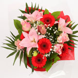 Birthday Balloon & Pink Red Deluxe FlowersThis Beautiful Bouquet, carefully selected flowers with foliage are expertly arranged to create this dramatic design. This stunning gift is the ultimate gift to create an impression. Beautifully wrapped and tied w