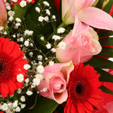 Pink & Red Deluxe BouquetThis Beautiful Bouquet, carefully selected flowers with foliage are expertly arranged to create this dramatic design. This stunning gift is the ultimate gift to create an impression. Beautifully wrapped and tied with ribbon before