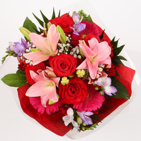 Red & Pink Delight BouquetThis Beautiful Bouquet, carefully selected flowers with foliage are expertly arranged to create this dramatic design. This stunning gift is the ultimate gift to create an impression. Beautifully wrapped and tied with ribbon befor
