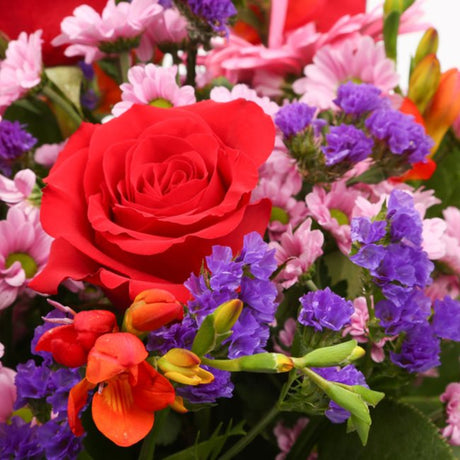 Birthday Balloon & Red Blush FlowersThis Beautiful Bouquet with Balloon, carefully selected flowers with foliage are expertly arranged to create this dramatic design. This stunning gift is the ultimate gift to create an impression. Beautifully wrapped and