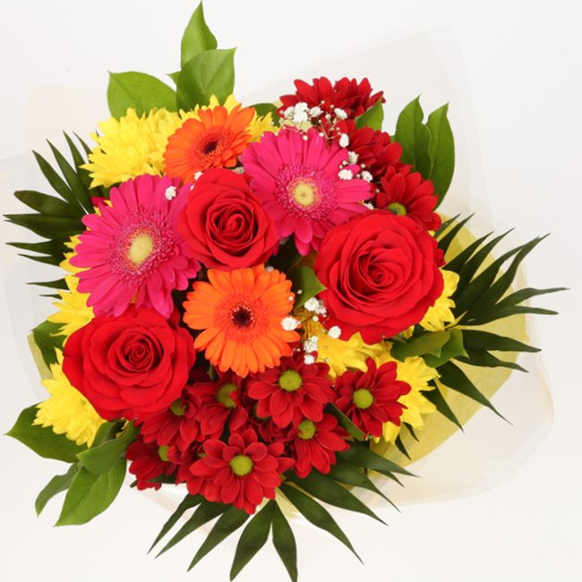 Beauty Blooms Bouquet FlowersThis Beautiful Bouquet, carefully selected flowers with foliage are expertly arranged to create this dramatic design. This stunning gift is the ultimate gift to create an impression. Beautifully wrapped and tied with ribbon be