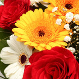 Celebration FlowersThis Beautiful Bouquet, carefully selected flowers with foliage are expertly arranged to create this dramatic design. This stunning gift is the ultimate gift to create an impression. Beautifully wrapped and tied with ribbon before being